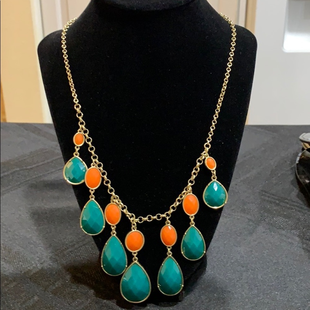 Gold toned necklace with green and orange beads